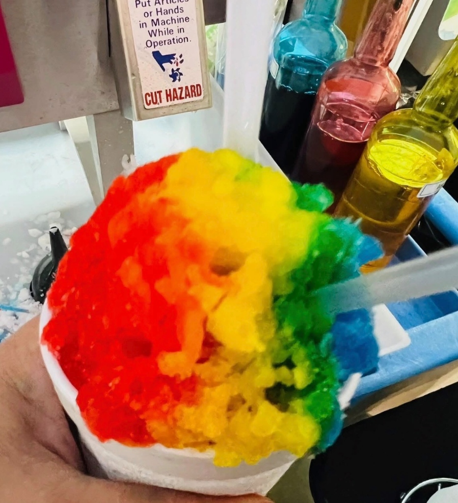 Vibrant rainbow snoball at event stand